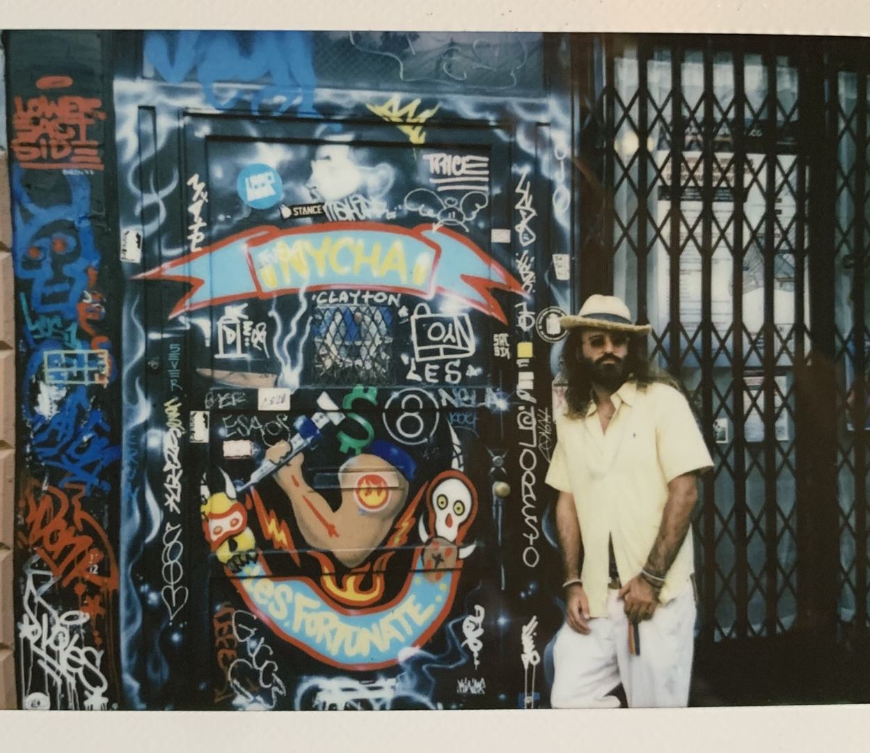 DJ Bones by the graffiti-covered doorway