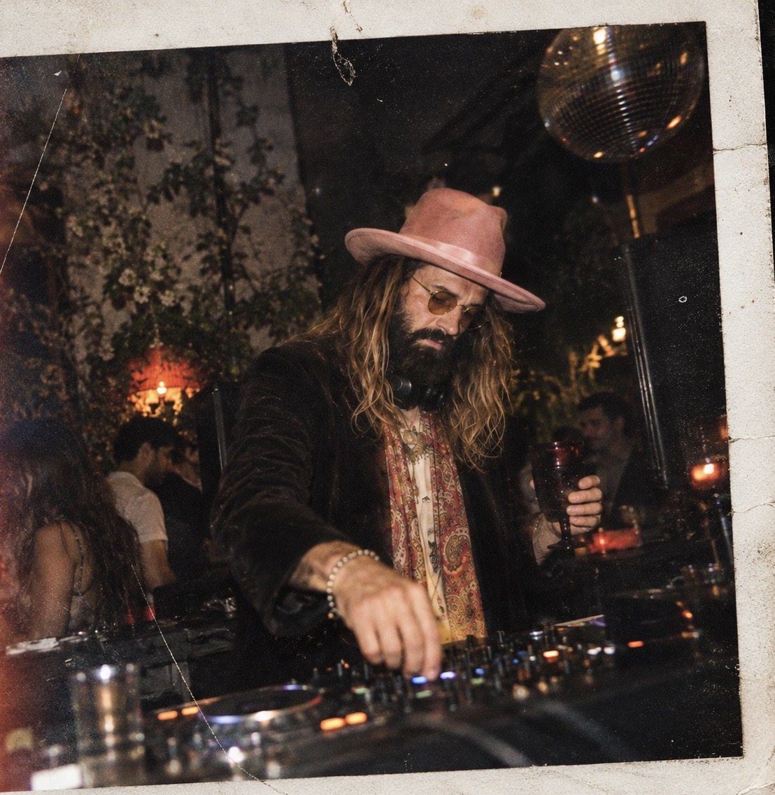DJ Bones DJing in a pink hat