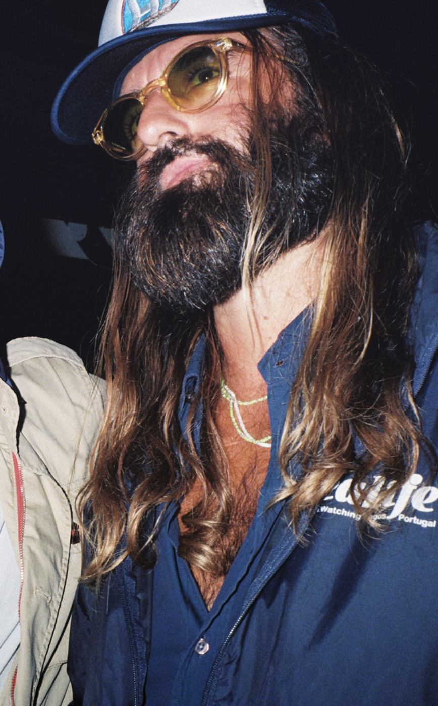 Close-up portrait of DJ Bones wearing yellow glasses